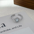 Macro shot of silver open ring featuring a light blue gemstone and multi-diamond pavé setting - Adjustable Open / Vintage Noble Round Style (JZ0538A)