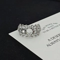 Close-up of a silver cocktail ring with shimmering moonstone and zircons on card - Luxury Cocktail Ring Style (JZ5440)