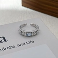 Detail of blue zircon open ring with silver hollow pattern and beaded edge design - Adjustable Open / Vintage Hollow Oval Style (JZ3025A)
