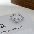 Detail of silver heart ring with blue zircon stones and adjustable open band - Adjustable Open