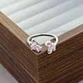 Close-up of pink marquise zircon butterfly ring on a premium wooden jewelry box - Pink Petal Butterfly Style (JZ0591A)