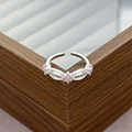 Detailed macro of silver adjustable ring featuring pink zircon stones and pavé crystals - Pink Gem Flower Bow Tie Style (JZ1422A)