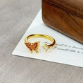 Macro detail of gold-plated open ring with orange zircon butterfly and square crystal - Orange Butterfly Square Zirconia Asymmetric(JZ1190A)