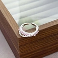 Detail of silver adjustable ring with pink marquise zircon stones on a wooden jewelry box - Double Loop Cross Multi-Color Style (JZ2540A)
