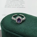 Detailed macro view of the oval purple gemstone and cubic zirconia on silver ring - Adjustable Open / Purple Oval Halo Style (JZ3095A)