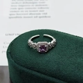 Detailed macro view of silver-tone ring with square purple zircon and engraved side band - Adjustable Open / Purple Square Halo Vintage Style (JZ6273)