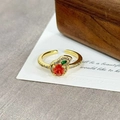Detail of vintage apple ring with orange zircon and pave crystals on a white card - Apple Style Orange Red Gemstone(JZ5355)
