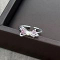 Detail of silver bow ring with pink heart zirconia and central white pearl accent - Adjustable Open / Pink Heart Pearl Bowknot (JZ0586A)