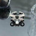 Close-up of bow ring with black heart stone and sparkling teardrop zircon pendant - Black Heart Drip Bowknot Style (JZ0214)