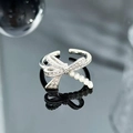 Detail of silver bow ring featuring sparkling zircons and delicate white pearls - Elegant Pearl Bowknot Style (JZ0246)