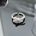 Macro detail of silver bow tie ring with pavé zircons and adjustable open band design - 3D Full Rhinestone Bowknot Style (JZ0488)