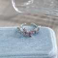 Macro shot of silver butterfly open ring with pink zircon stones on blue velvet case - Adjustable Open / Pink Rhinestone Double Butterfly Style (JZ0828A)