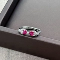 Close-up of bowknot ring with red heart-shaped gemstones and sparkling zircons - Adjustable Open / Red Heart Stone Bowknot (JZ5855)