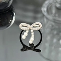 Detail of silver bow ring with sparkling zircons and dangling white pearl charms - Pearl Pendant Full Rhinestone Bowknot Style (JZ4476)