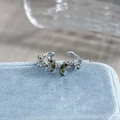 Macro detail of silver butterfly ring with green stones and sparkling pavé diamonds - Adjustable Open / Olive Green Crystal Butterfly Style (JZ2197A)