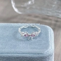 Detail view of silver butterfly open ring with pink stones on blue velvet box - Adjustable Open / Pink-Purple Bowknot Style (JZ2203A)