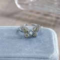 Macro shot of butterfly open ring with blue gemstone and diamonds on blue velvet box - Adjustable Open / Light Blue Rhinestone Butterfly Style (JZ2814A)