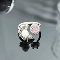 Macro shot of silver bow ring with pink gemstone, pearl and sparkling zircon details - Pink Stone Pearl Bowknot Style (JZ4951)