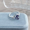 Macro shot of silver butterfly ring with purple pear-cut zircons on a blue velvet box - Adjustable Open / Purple Floral Style (JZ2939A)