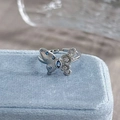 Macro shot of a silver butterfly ring with blue crystals on a velvet jewelry box - Adjustable Open / Blue Floral Butterfly Style (JZ2953A)