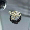 Macro detail of silver bow ring featuring sparkling yellow zircon micro-pave setting - Light Yellow Zircon 3D Bowknot Style (JZ6158)