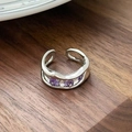 Macro shot of silver wave ring with purple zircon stones and adjustable open band - Double Layer Wave Round Zirconia Style(JZ0870)