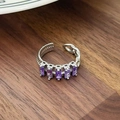 Close-up of adjustable silver ring with five purple rectangular zircons on wood - Rectangular Gemstone Chain Style(JZ1217)