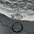 Macro shot of double butterfly ring featuring purple zircon stones on black plated metal - Purple Butterfly Black Ring (JZ4028)