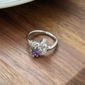 Detailed close-up of a silver ring featuring a purple heart gemstone and floral diamonds - Heart Purple Stone Butterfly Shape Style(JZ5396)