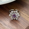 Macro detail of the purple crystal ring with snowflake zircon setting and silver finish - Snowflake Radial Square Purple Stone Style(JZ5911)