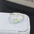 Macro detail of French style heart-shaped green crystal open ring in silver finish - Grass Green Heart Style (JZ2029A)