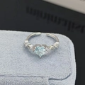 Detailed view of heart-shaped light blue zircon ring with micro-pave accents on blue velvet - Sky Blue Heart Style (JZ3026A)