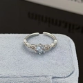 Detail of light blue gemstone ring with hollow woven band and silver plating - Light Blue Hollow Woven Style (JZ3027A)