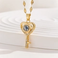 Close-up of gold heart key pendant necklace with projection stone and zircon accents - Heart Key with Zirconia (TP-04254-01)