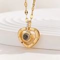 Detail of gold heart projection necklace with Roman numerals and red gemstone inlay - Roman Numerals Red Gem Heart (TP-04251-01)