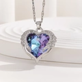 Blue crystal heart necklace with silver angel wings on white platform background - Blue Purple Gradient Angel Wings Style (TP-04279-02)