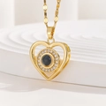 Macro shot of gold heart projection necklace with zircon inlay on decorative stand - Double Heart Surround with Zirconia (TP-04258-01)