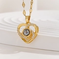 Macro shot of gold heart pendant necklace with micro-encrusted zircons and projection stone - Hollow Double Heart with Zirconia (TP-04252-01)