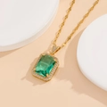 Detailed macro of vintage square emerald pendant with gold plating and sparkling zircon setting - Gold Lake Blue Necklace