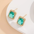 Detail of vintage gold stud earrings with rectangular emerald zircon and micro-pave crystals - Gold Lake Blue Earrings
