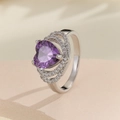 Macro shot of a heart-shaped purple zircon ring with multi-layer pavé setting details - US 7 / Silver Purple