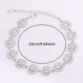Detail of silver smiley face link bracelet with sparkling crystals and pink gem eyes - Silver Bracelet Red Corundum Color