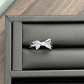 Close-up of silver butterfly ring with pink heart zircons and a white pearl accent - Butterfly Knot Heart Pink Zirconia Style (JZ0586A)