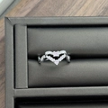 Macro shot of silver wave heart ring with pink zircon and diamonds on grey velvet box - Hollow Heart Pink Zirconia Style (JZ0720A)