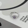 Macro detail of silver adjustable ring featuring a purple gemstone with floral pave setting - Purple Round Style (JZ0081A)