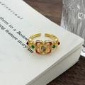 Dettaglio di anello vintage in smalto con gemma e filigrana su libro antico - Aperto Regolabile / Stile Floreale Smalto Cloisonné Gemma Tè (JZ6010)