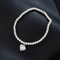 Elegantes S925 Silberperlenarmband mit Herzanhänger und minimalistischem Stretch-Design - Doppelschichtiges Herz mit Punkten (SL0331)