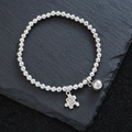 Silbernes Perlenarmband mit elastischem Band und einem gravierten Puzzle-Anhänger - Puzzleteil-Anhänger (SL0330)