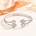 Detail of silver open bangle featuring pear-cut stones and micro-pave diamond setting - Silver Open Bangle