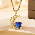 Elegant gold moon pendant necklace with heart-shaped blue stone and twisted rope chain - Royal Blue Crystal